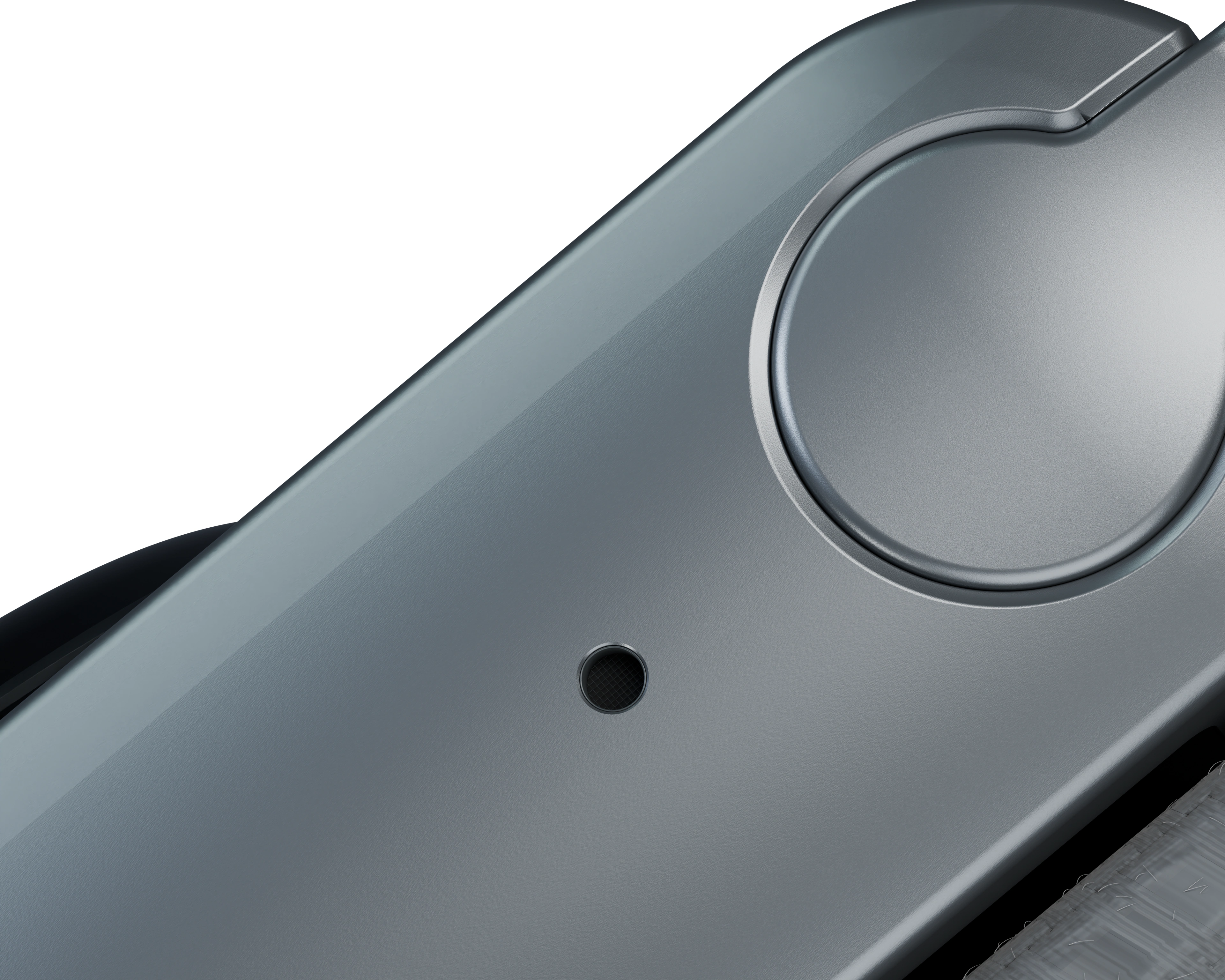 Close view of the small circular microphone port on Vexo Band